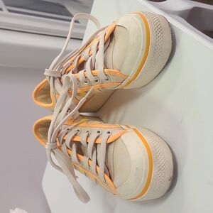 Off-White Canvas Sneakers with Vibrant Accents and Rubber Sole